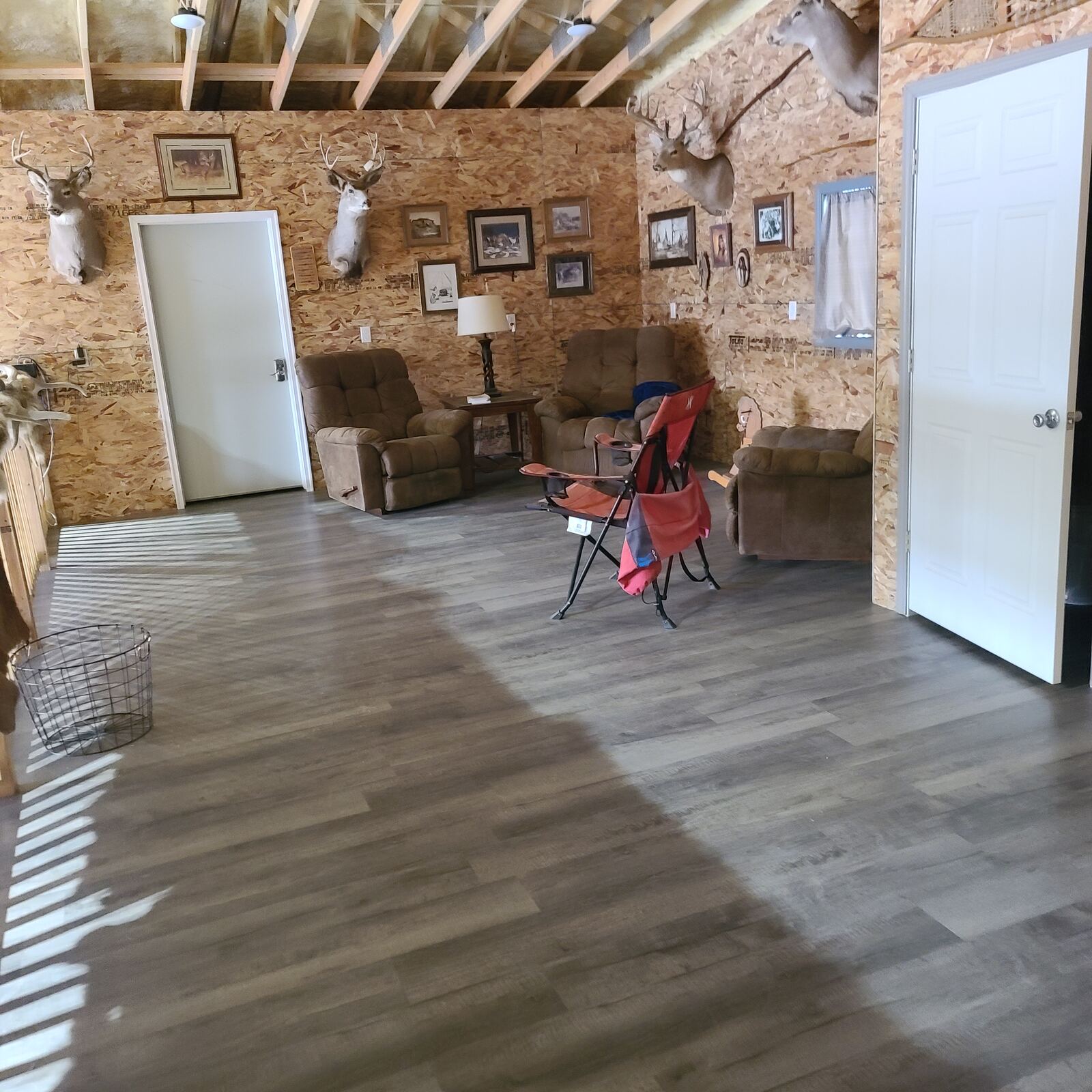 Interior shop room with new vinyl plank flooring and finished walls